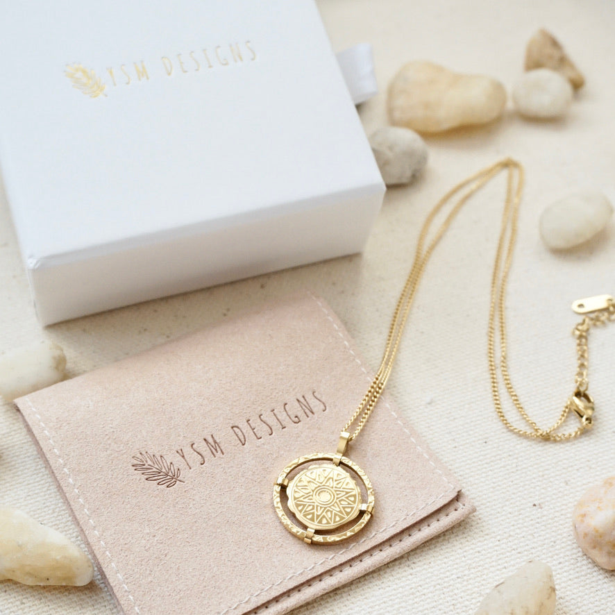 Gold sun coin necklace