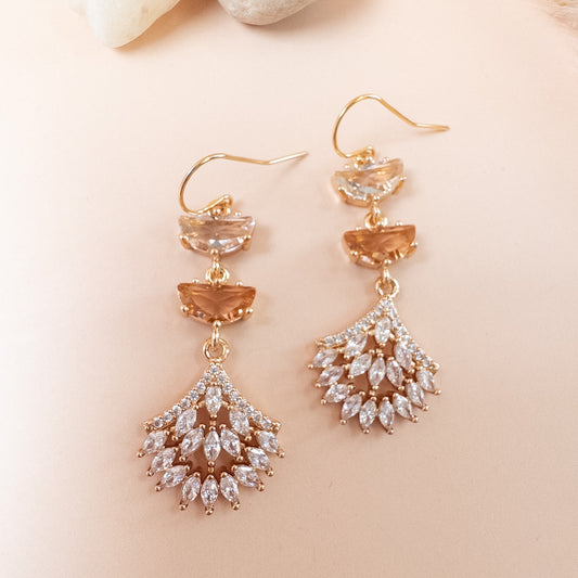 Close-up of clear and champagne half-moon crystals above marquise crystal fan