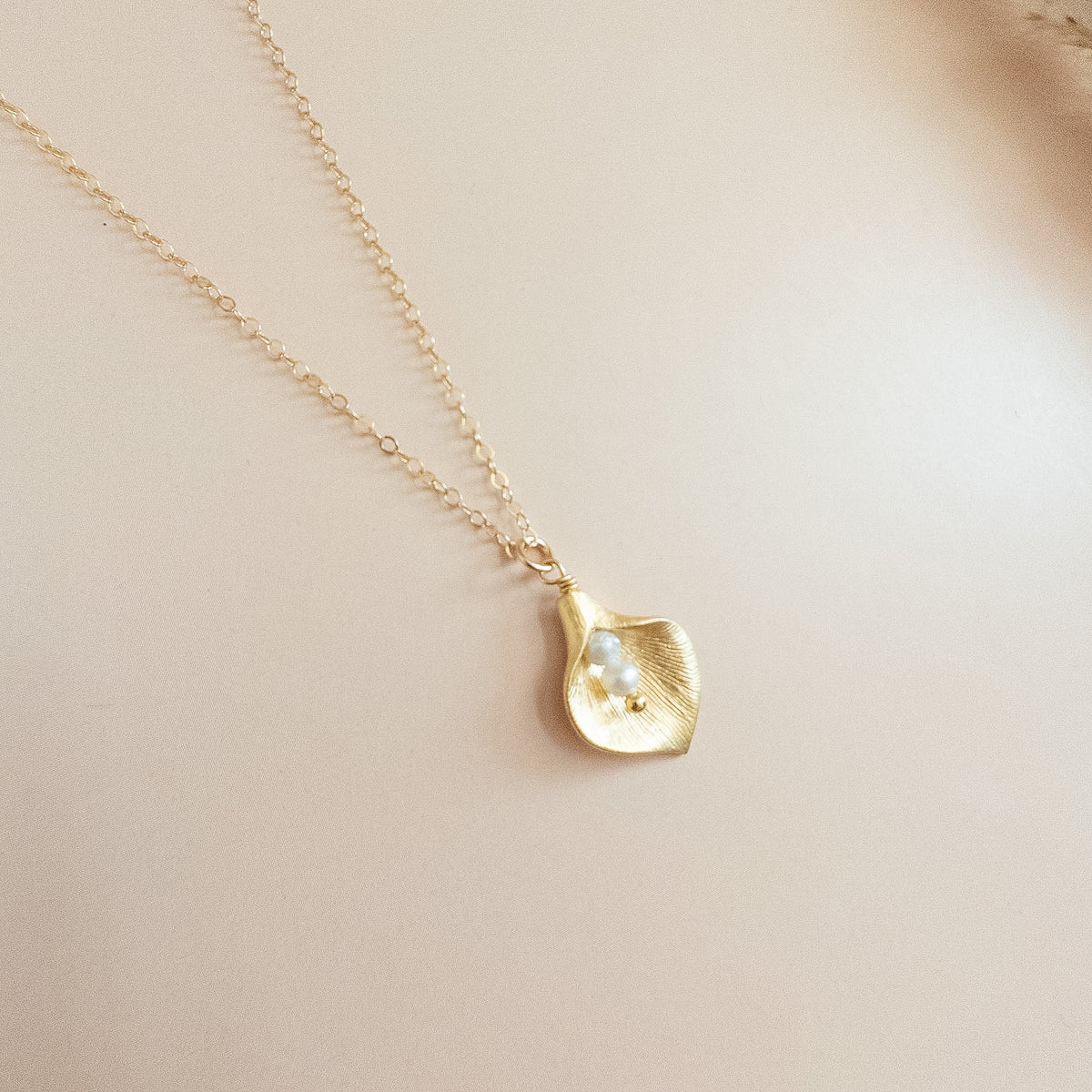 dainty gold calla lily flower necklace