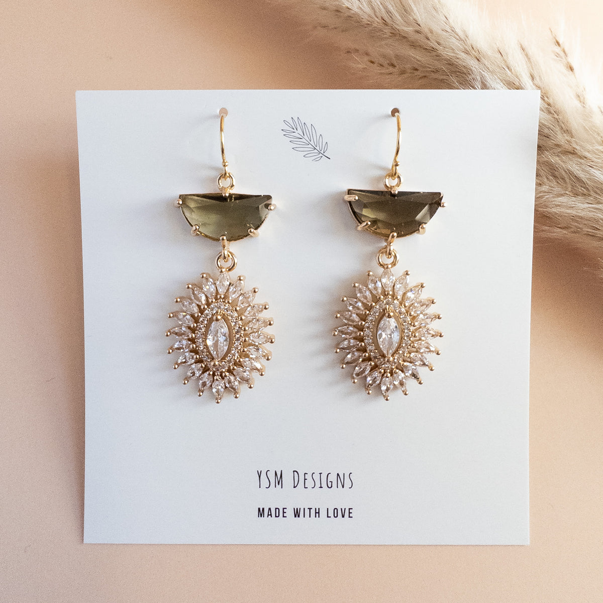 Smoky brown and clear crystal starburst drop earrings on YSM Designs card