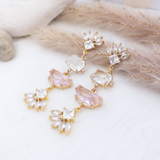 Statement earrings with fan shaped crystal posts and clear and pink crystals