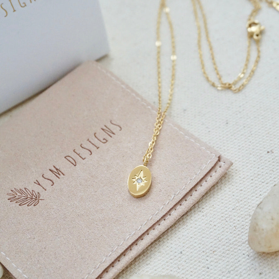 tiny oval gold north star necklace