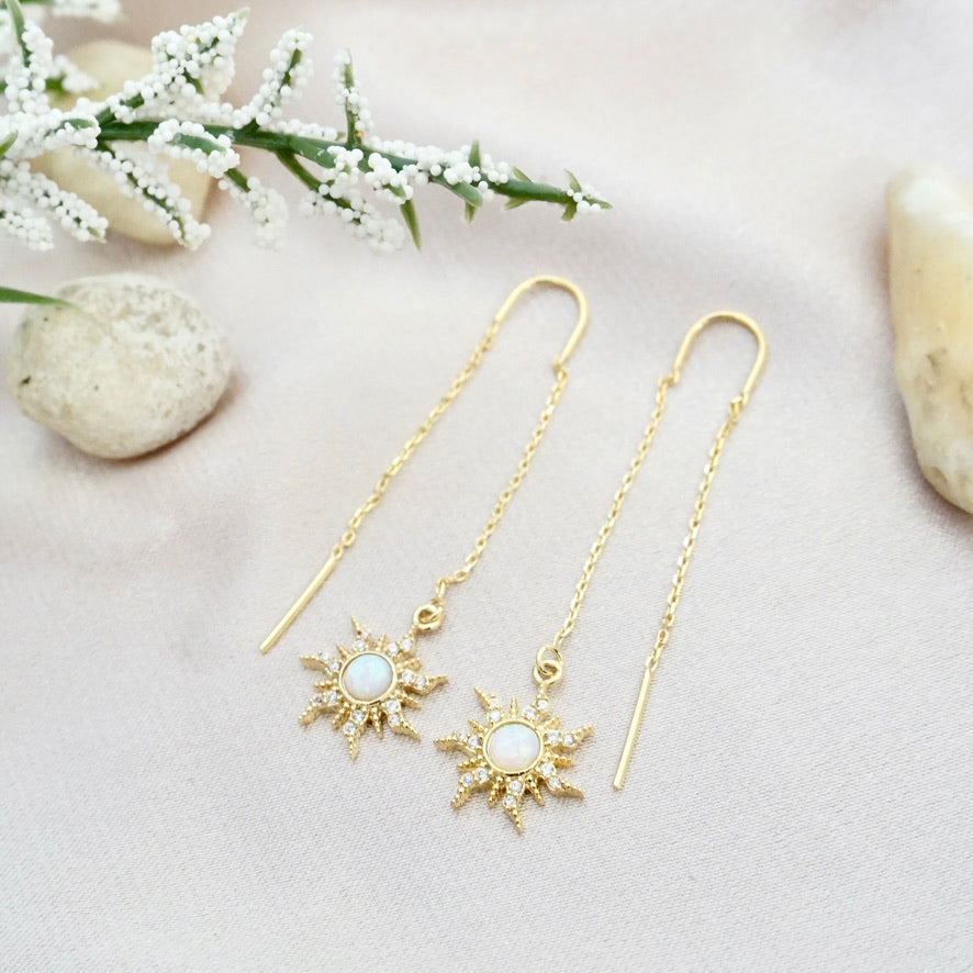 gold long chain earrings with sun charms