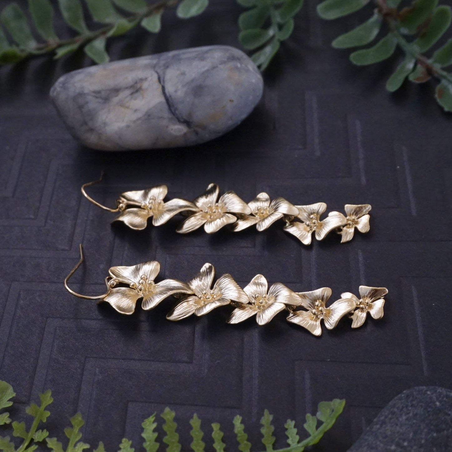 Gold flower statement earrings