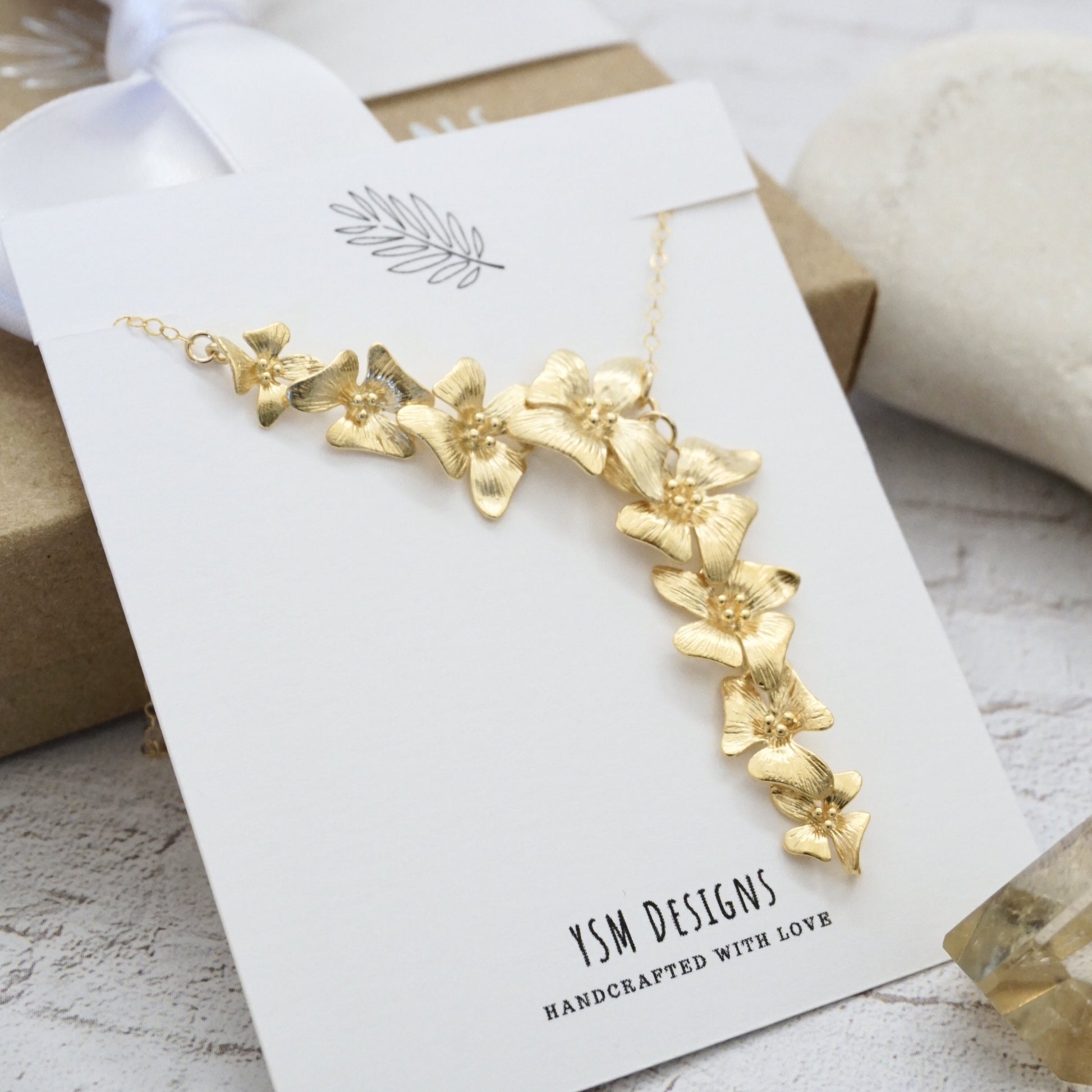 Gold floral necklace by YSM Designs