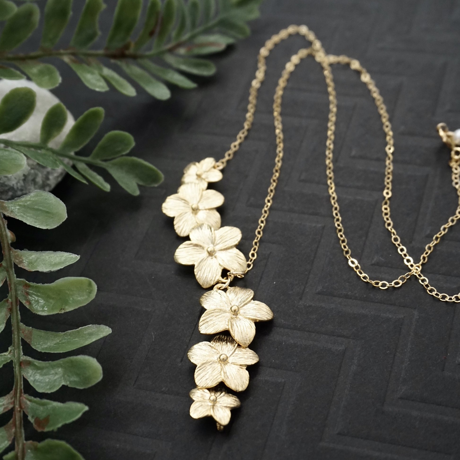 Gold plumeria flower necklace