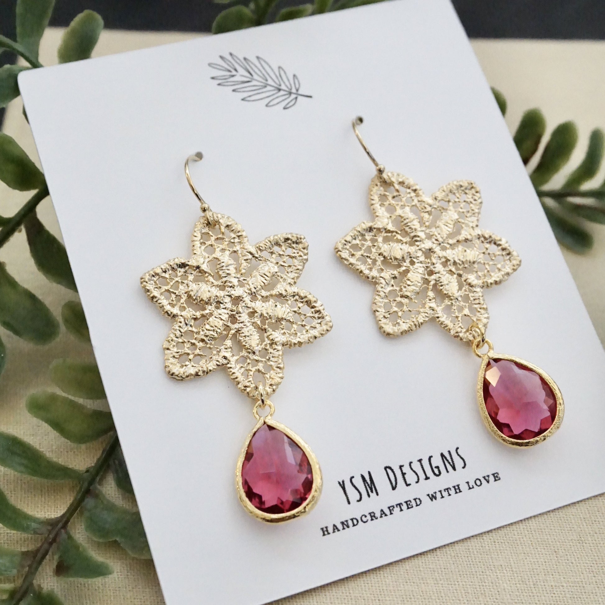 Red Holiday Earrings featuring poinsettia with red stones